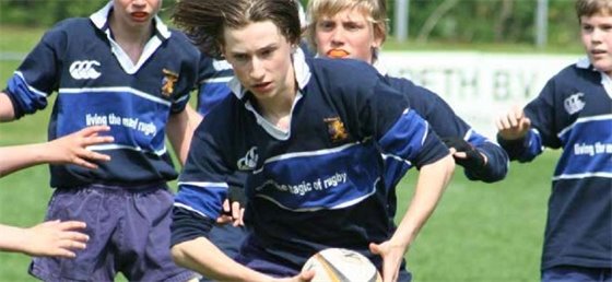 Youth playing rugby