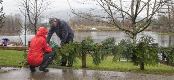 Two volunteers installing light elements
