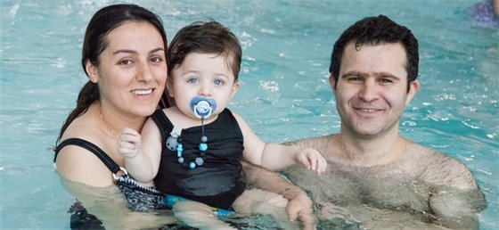 Family swimming in the pool