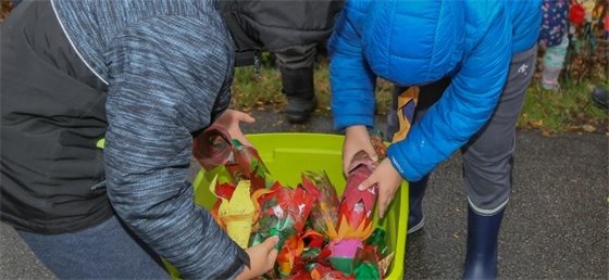 Children putting pop-bottle tulips away