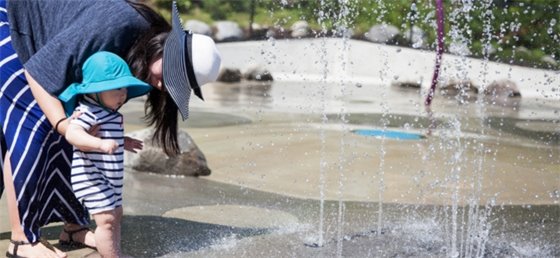 Parent and child at the spray park