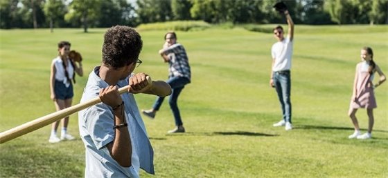 Friends playing baseball