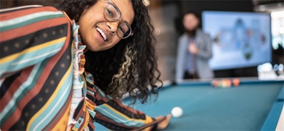Adults playing pool