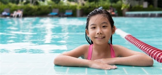Child in an outdoor pool