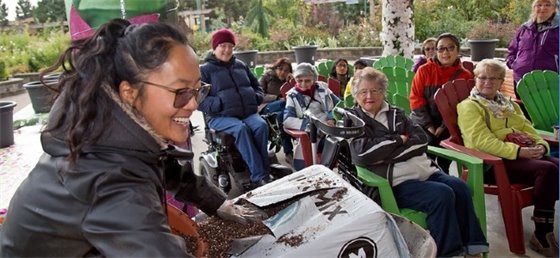 Staff leading a garden workshop