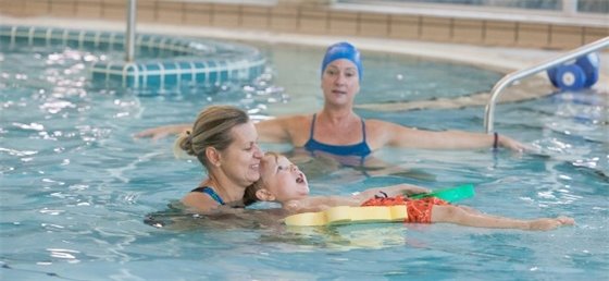 Parent and child in a swimming lesson
