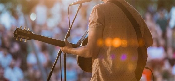 Adult playing guitar