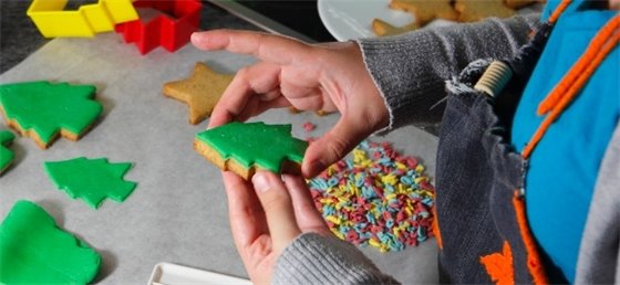 Child decorating cookies