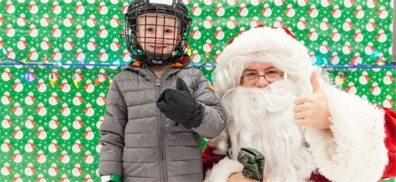 Child with Santa during skate