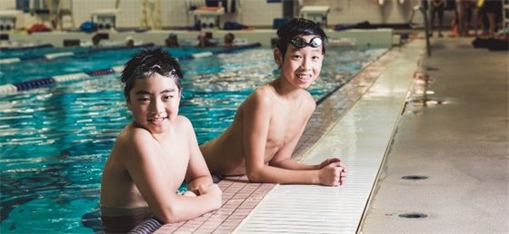 Two youth swimming