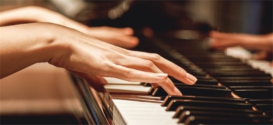 Hands playing piano