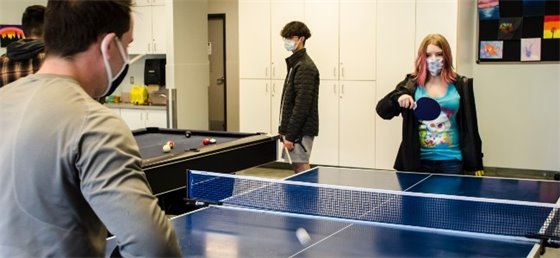 Youth playing ping pong