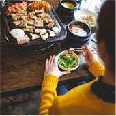 A person enjoys a meal at a local restaurant