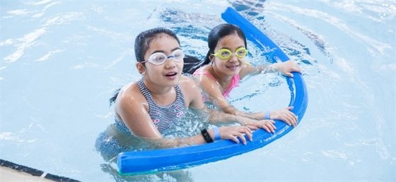 Two children swimming