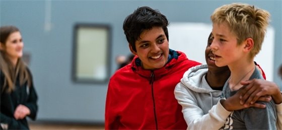 Youth hugging