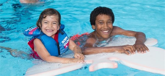 Two children swimming