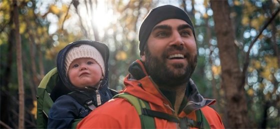 Adult and baby hiking