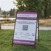 Image of a sandwich board for Kaleidoscope Arts Festival listing the corporate partners who supported the event.