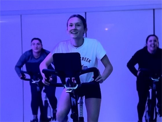 Patrons in a group cycle class.