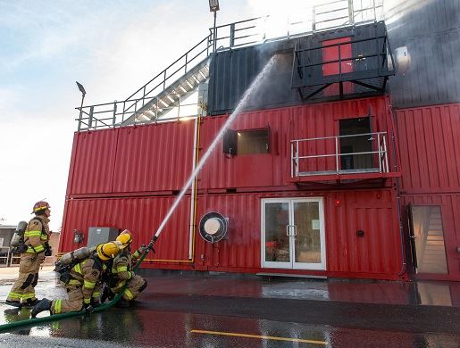 Fire Rescue trainees practice fire repression at the fire training centre facility