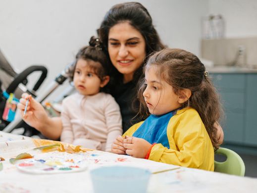 Mother and children participating in recreation activity