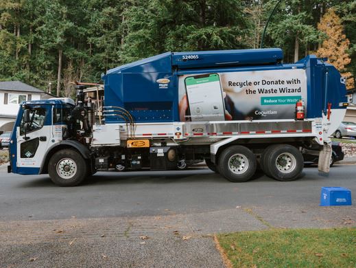 Garbage truck with Coquitlam's Reduce Your Waste branding on the side