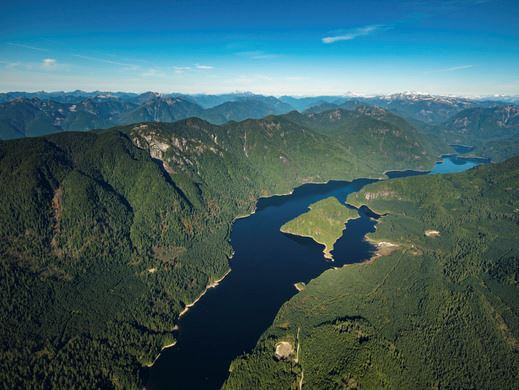 Aerial photograph on a clear day of Coquitlam Lake Reservoir and mountains