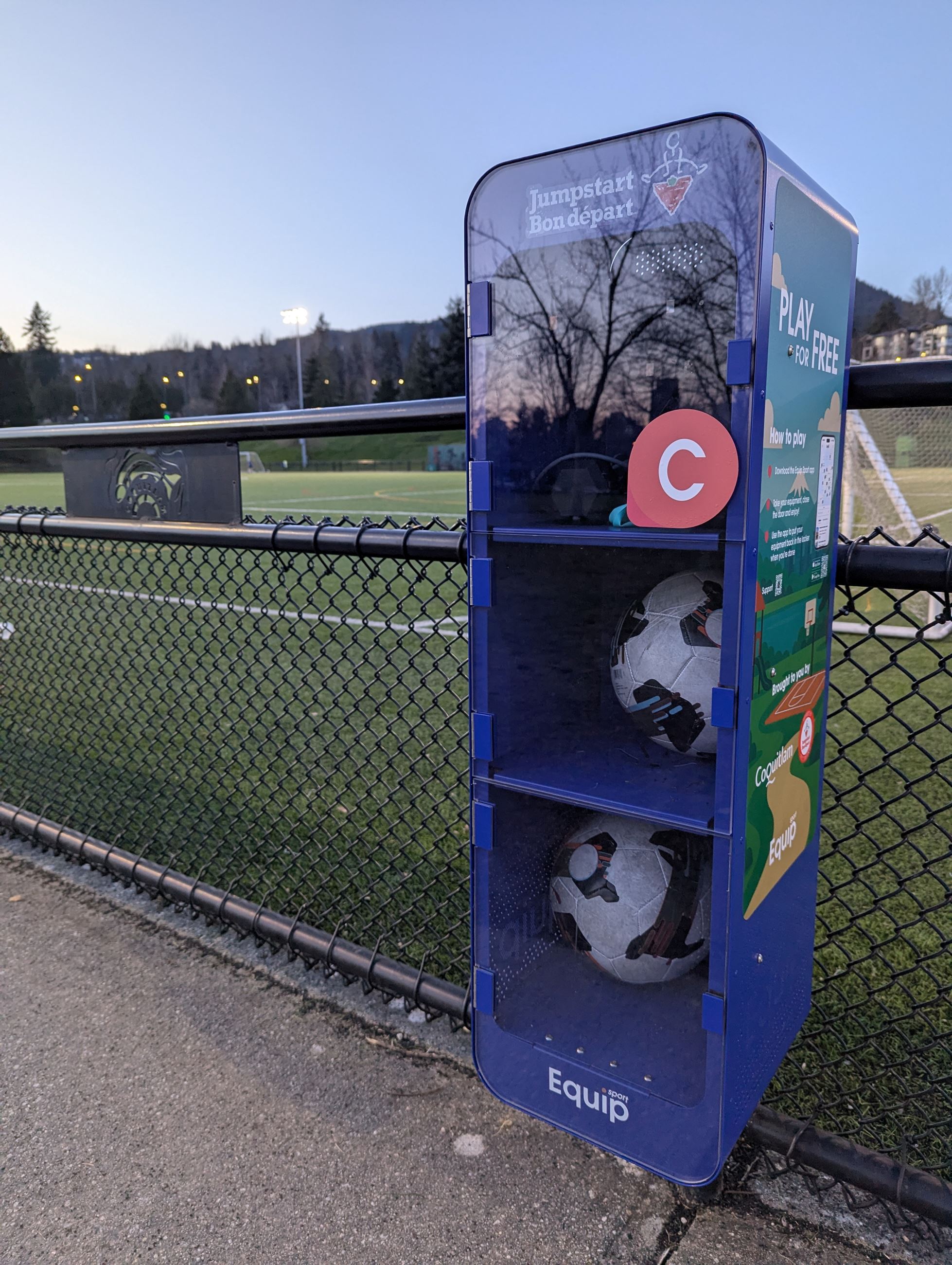 Equip Sport box with sports equipment at a Town Centre Park backdrop