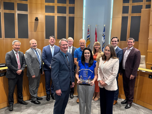 Mayor, Council and City staff holding the award in Council Chambers