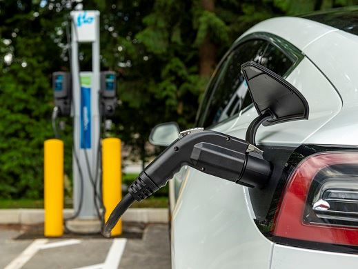 Tesla using EV Charging Station