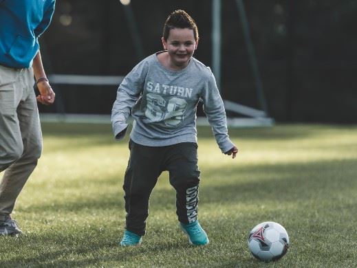 Child playing soccer