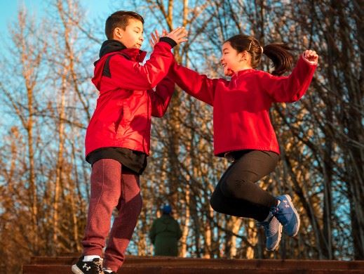 Two kids jumping