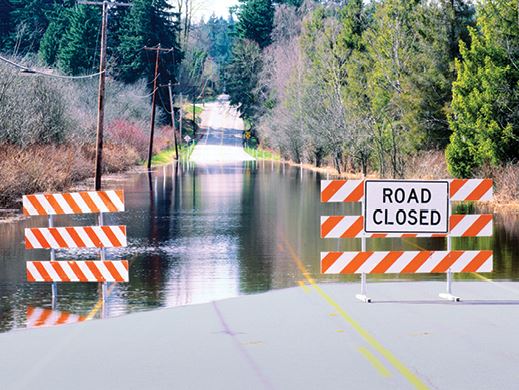Flooded Road with Road Closed Sign
