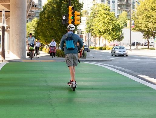 EScooter through intersection on MUP