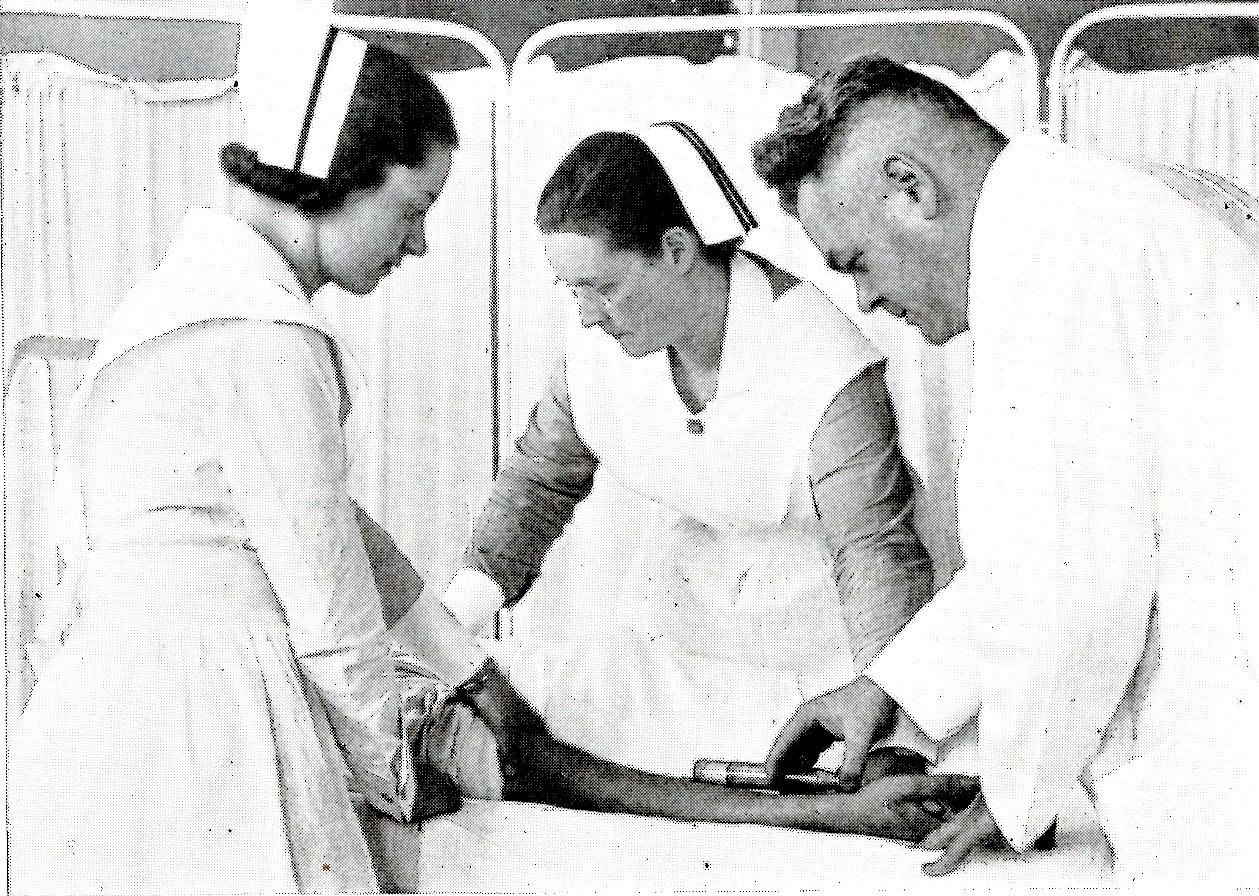 Dr. Ultan P. Byrne and two student nurses