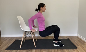 Woman Performing Tricep Dips with a Chair